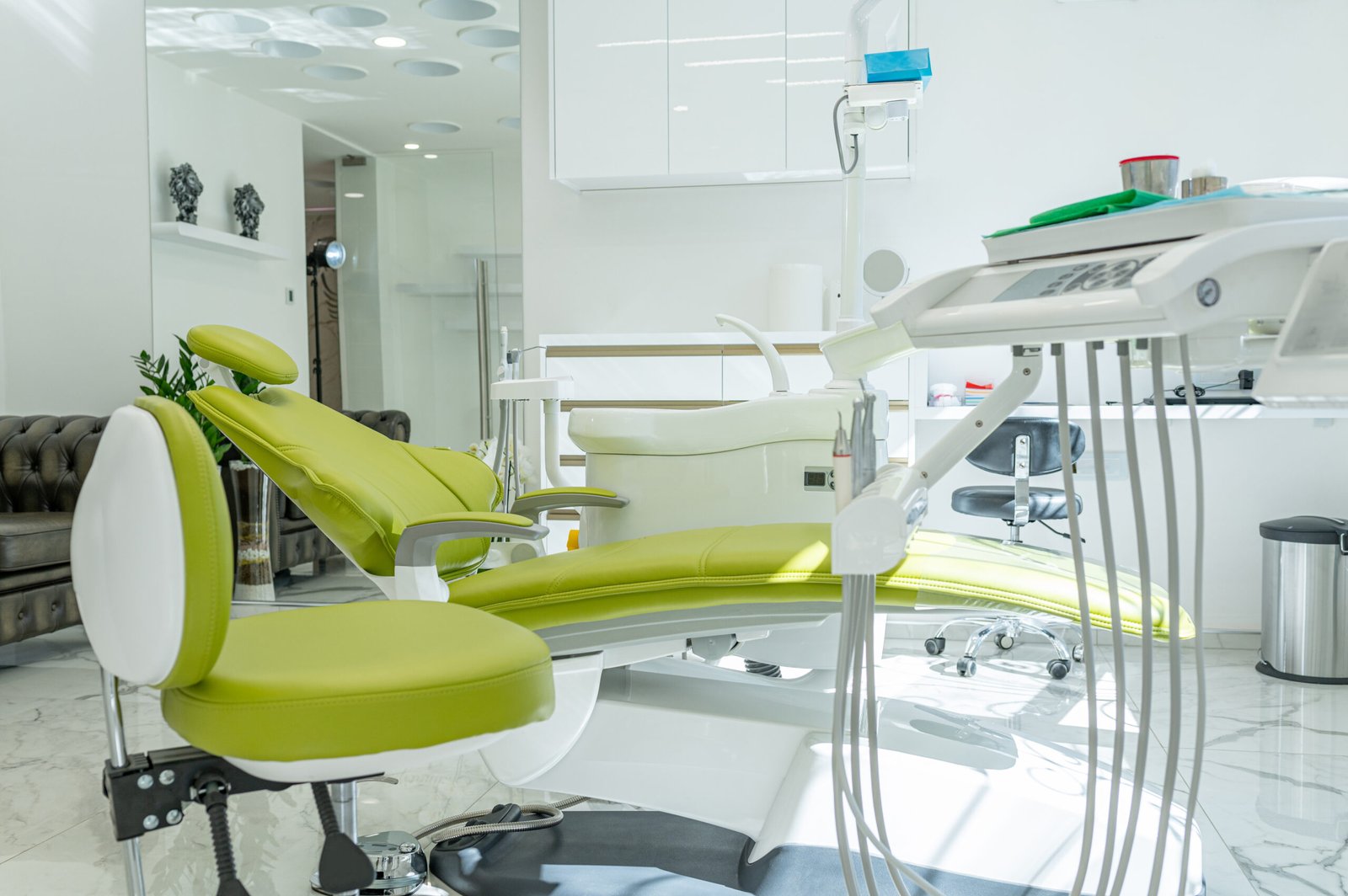 Stomatological instrument in dentists clinic. Dentist tools attached to a dental chair.